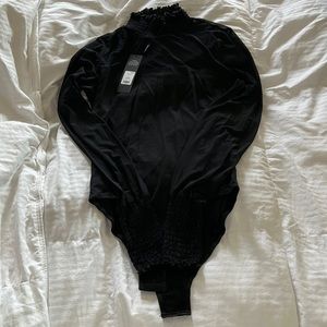 Half sheet fashion nova body suit size medium. Brand new. Very cute. Was too big